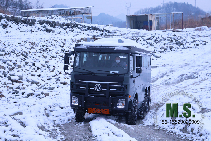 Dongfeng 6x6 off-road bus climbing slop on snowy land