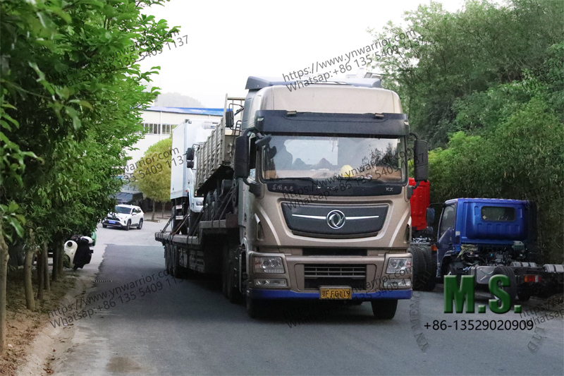 trailer truck carrying new vehicle ready to go